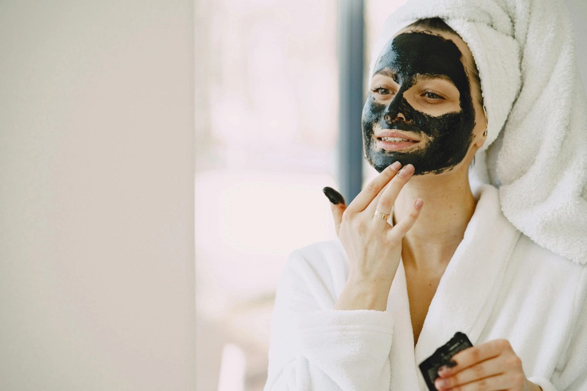 A woman doing facil mask